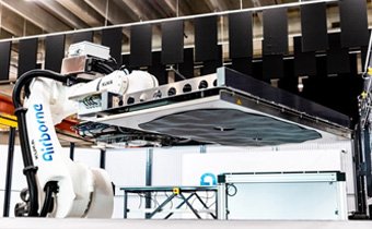 Modular, robotic cells enable high-rate RTM using any material format 