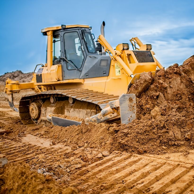 Bulldozer and motor grader performing rough and finish grading