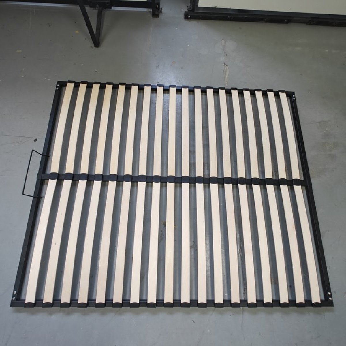 curved wooden slats on bed slat base