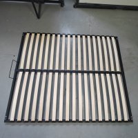 curved wooden slats on bed slat base