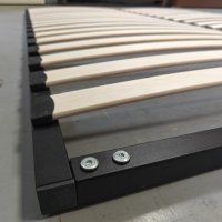 sturdy black metal frame of bed slat support